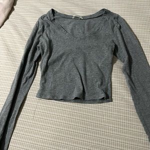 gray cropped top.